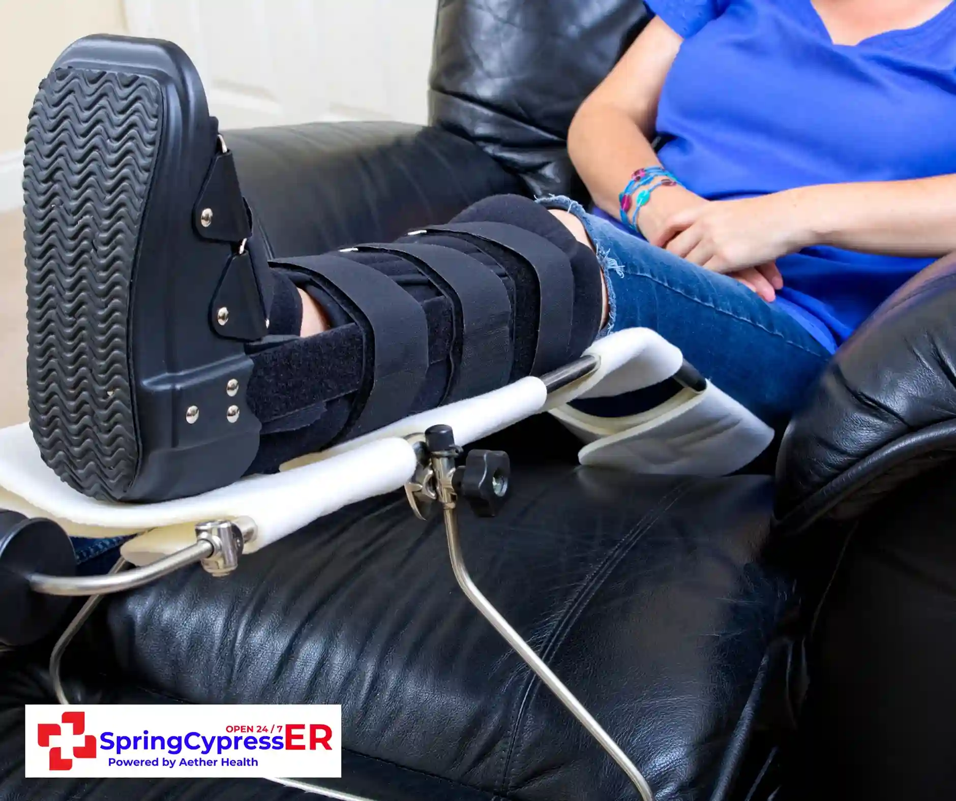 Doctor examining swelling and bruising around a patient’s arm fracture at Aether Health - Spring Cypress ER in Spring, TX